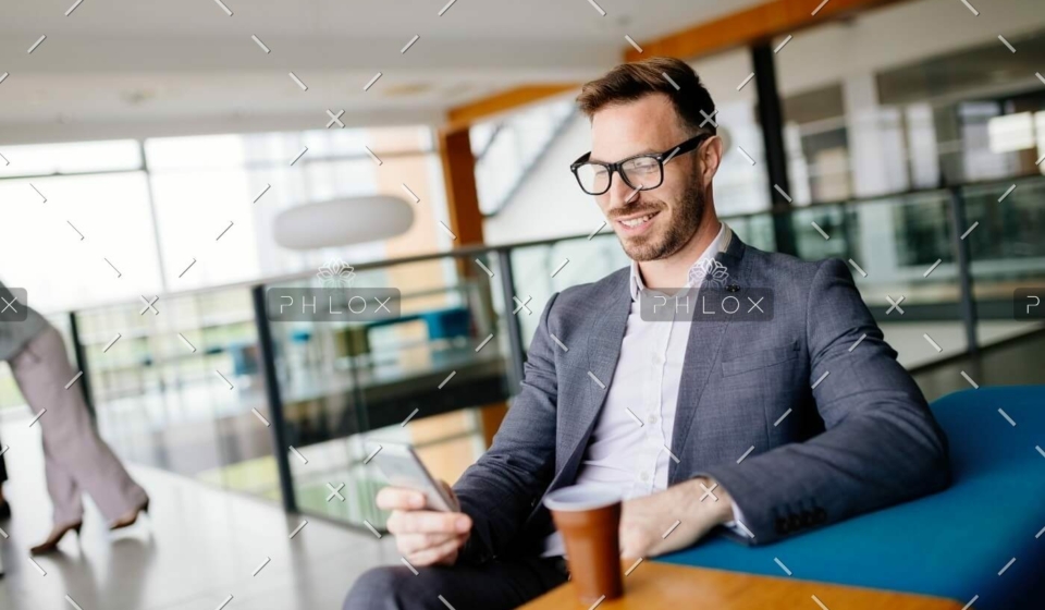 demo-attachment-502-businessman-taking-a-break-with-a-cup-of-coffee-JW4B3DH